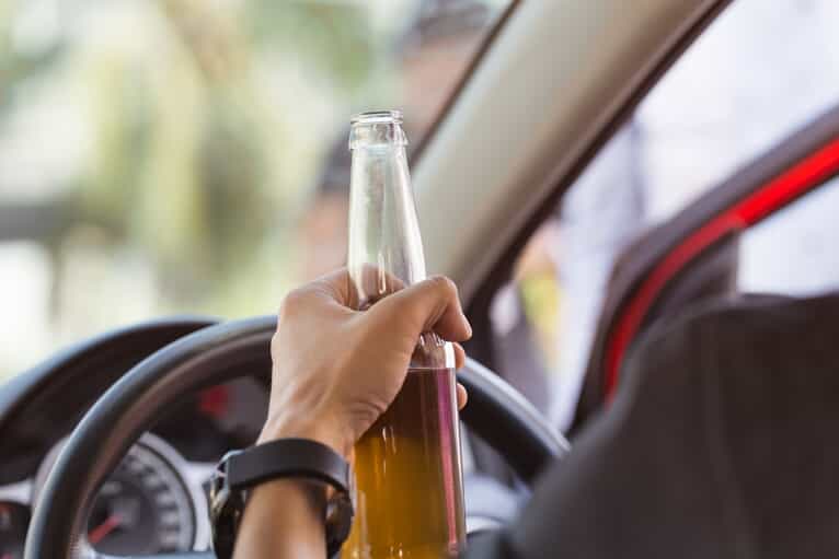 Man Driving with Beer in Hand